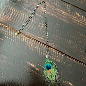 Love Poppy brand necklace, peacock feather gray stone detail hangs down 16”